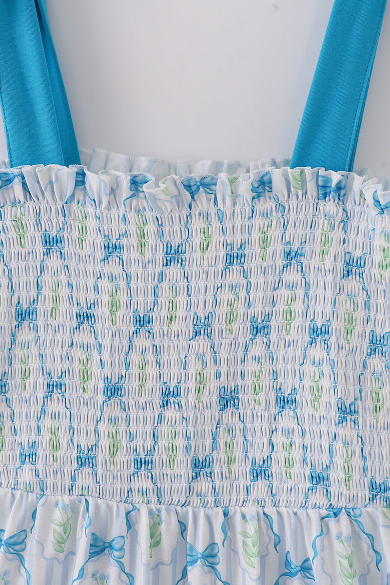 A charming blue floral mom dress with bow tie straps, perfect for spring.