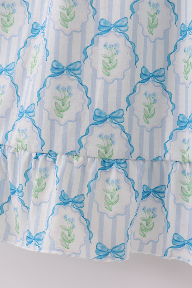 A charming blue floral mom dress with bow tie straps, perfect for spring.