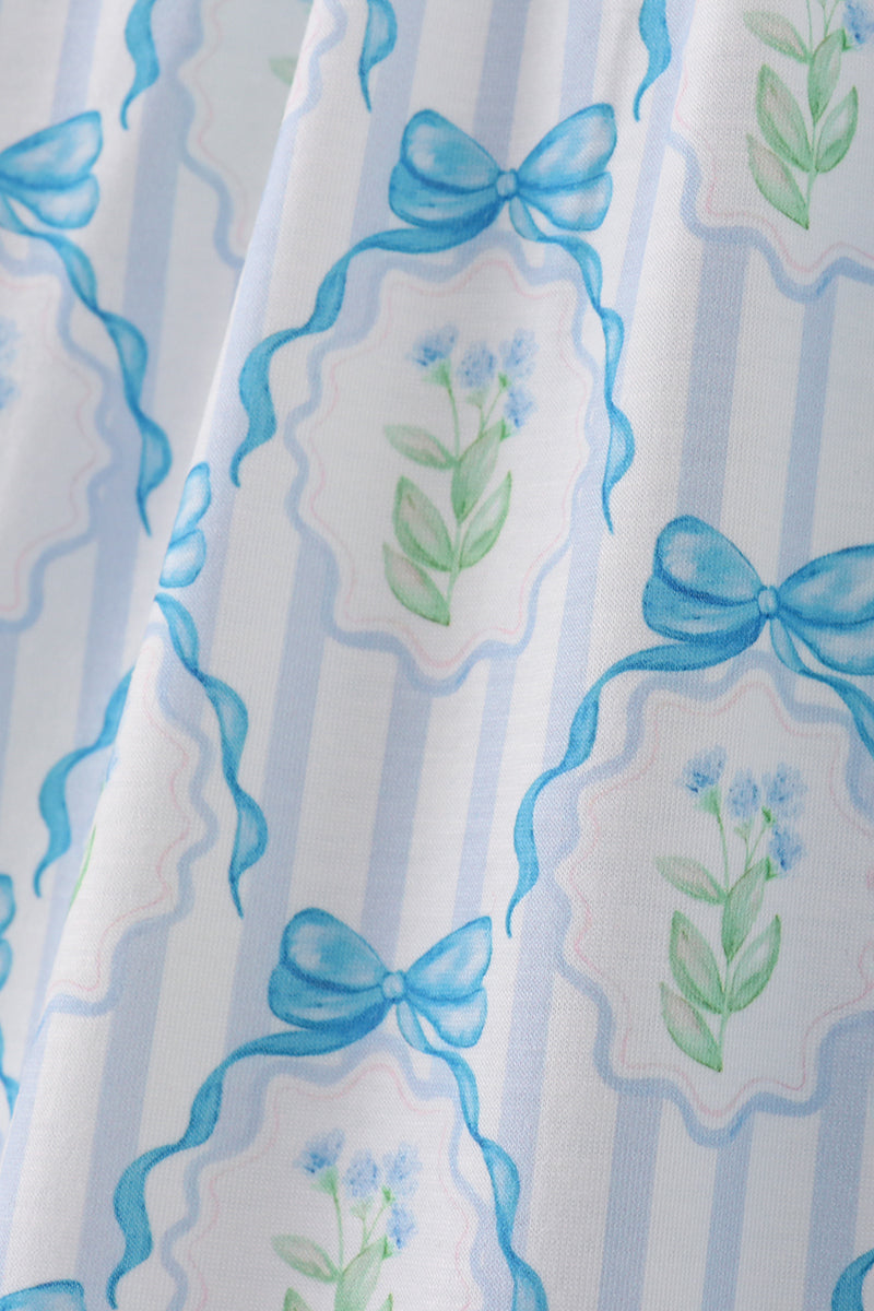 A charming blue floral mom dress with bow tie straps, perfect for spring.