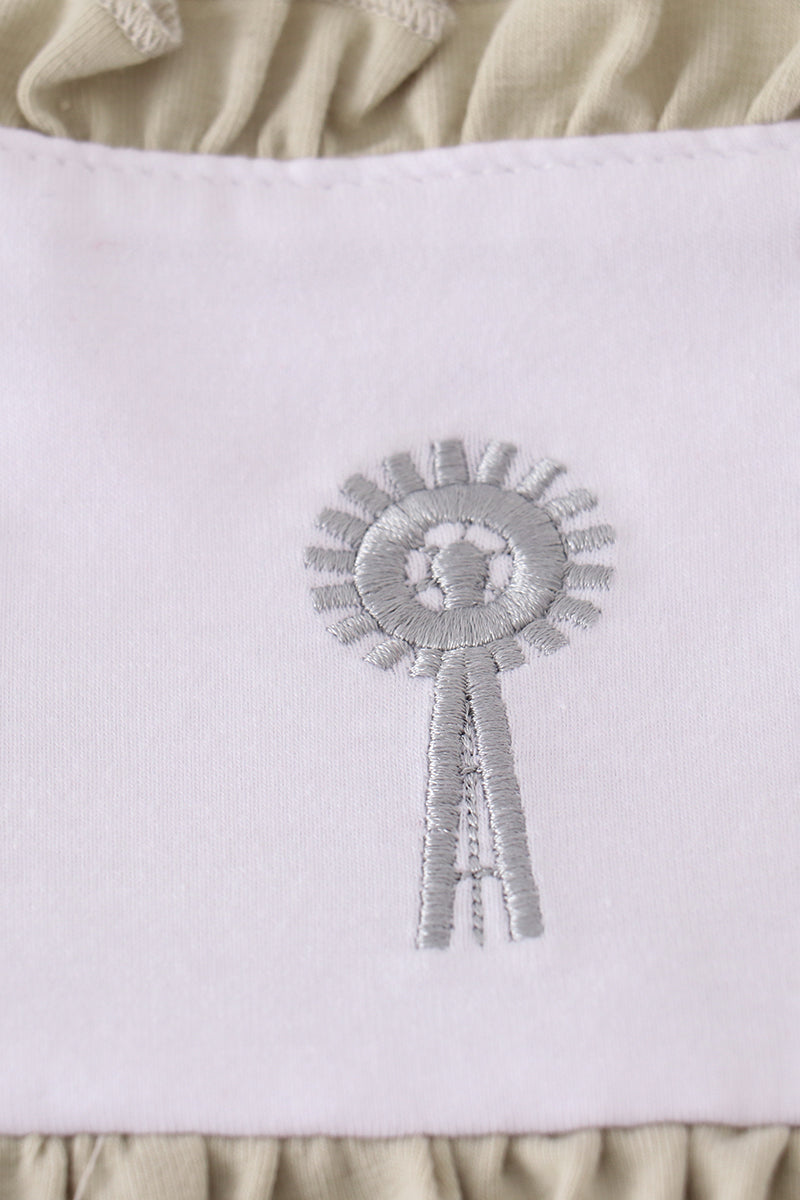 Green ruffle bubble with farm windmill embroidery, perfect for playful adventures.