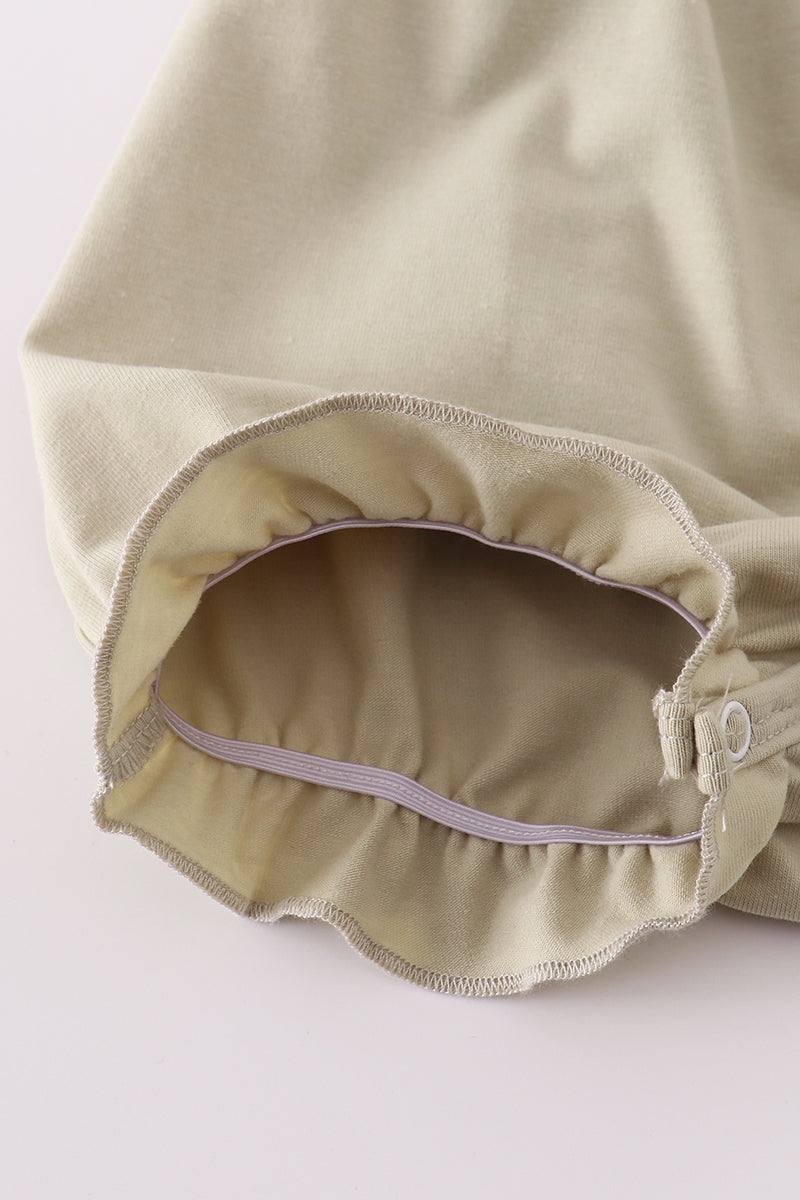 Green ruffle bubble with farm windmill embroidery, perfect for playful adventures.